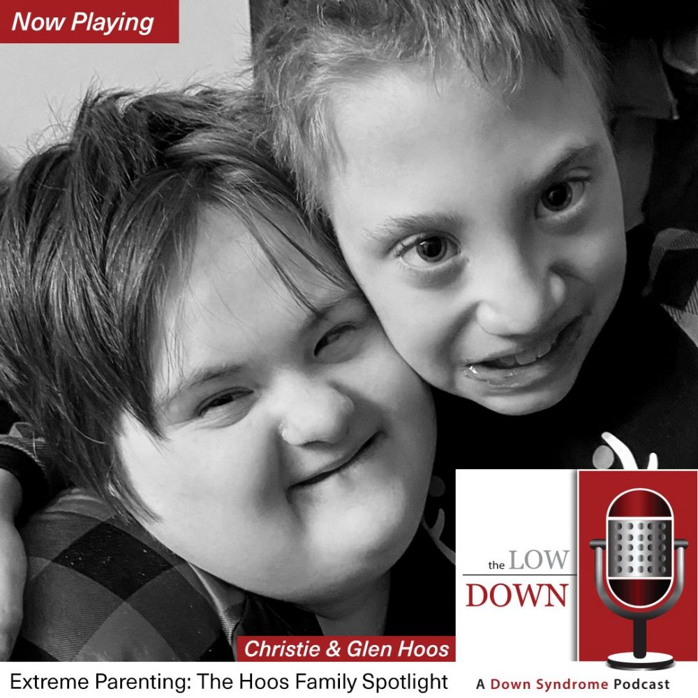 Boy and girl with developmental disabilities embrace
