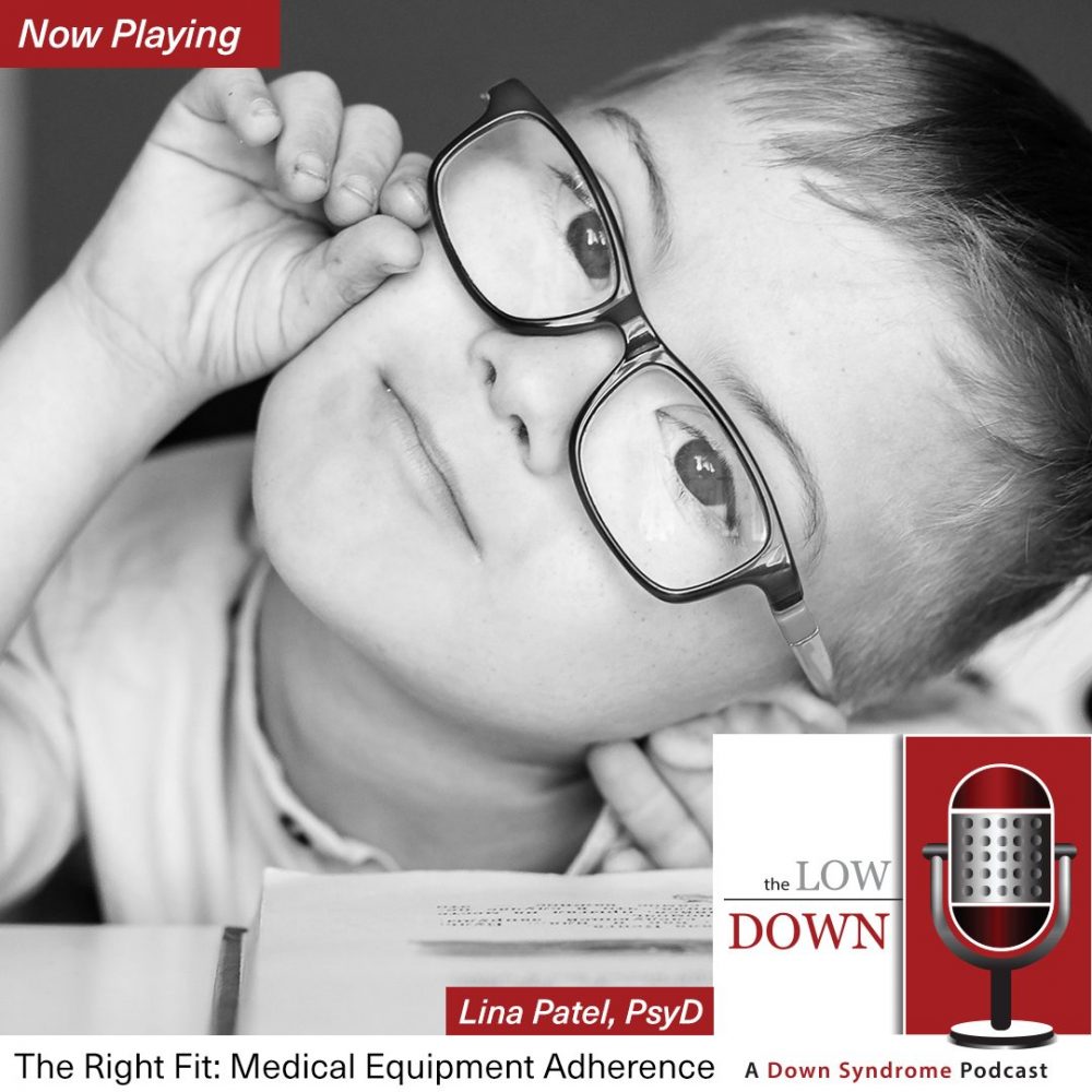 Boy with Down syndrome wearing glasses tilts head