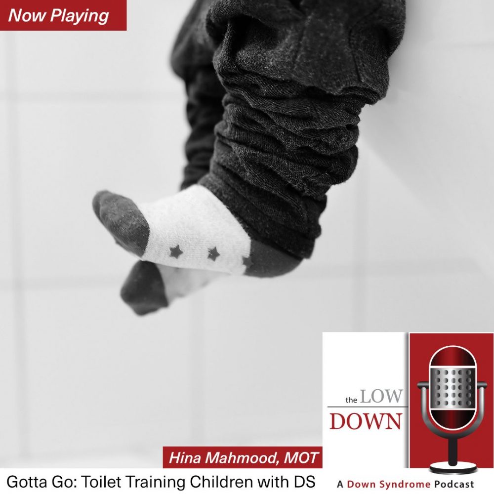 Child's feet dangling on toilet