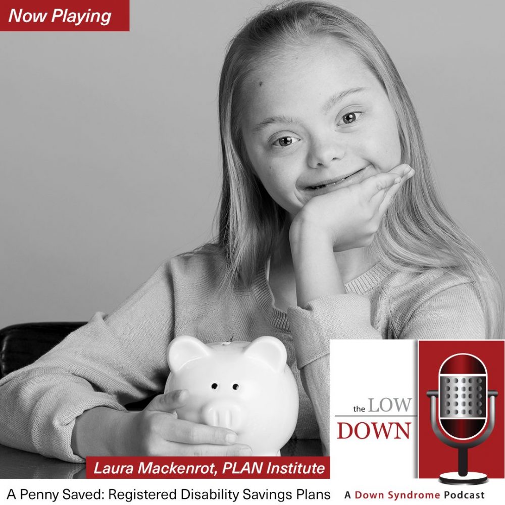 Smiling girl with Down syndrome holding piggy bank