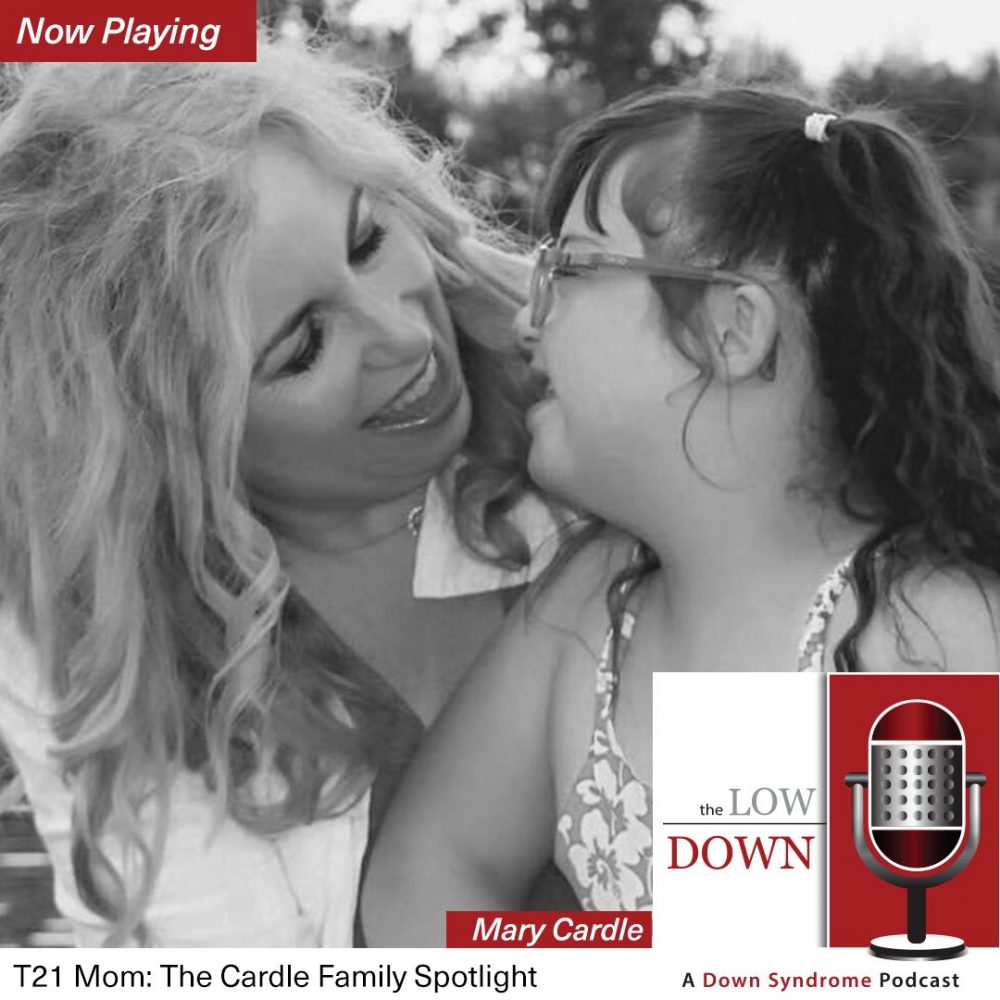 Girl with Down syndrome laughing with her mom
