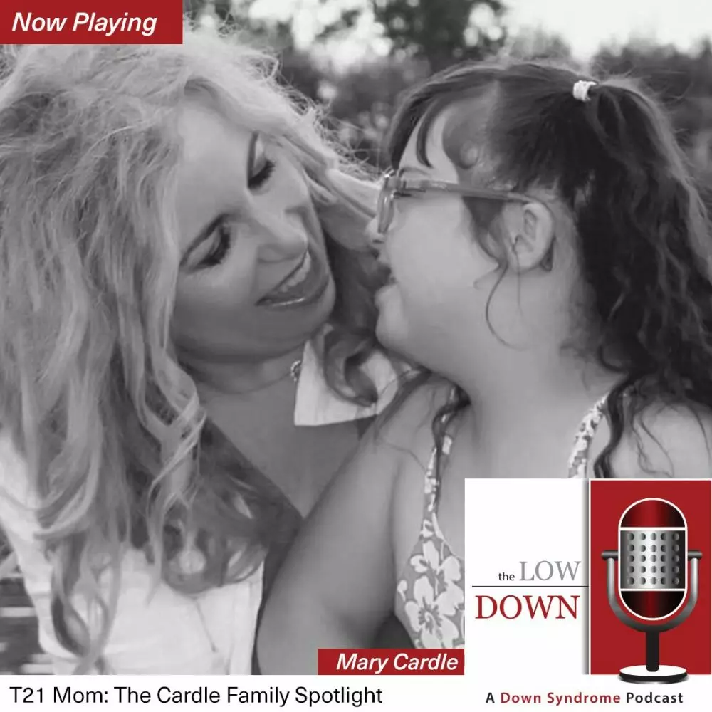 Girl with Down syndrome laughing with her mom
