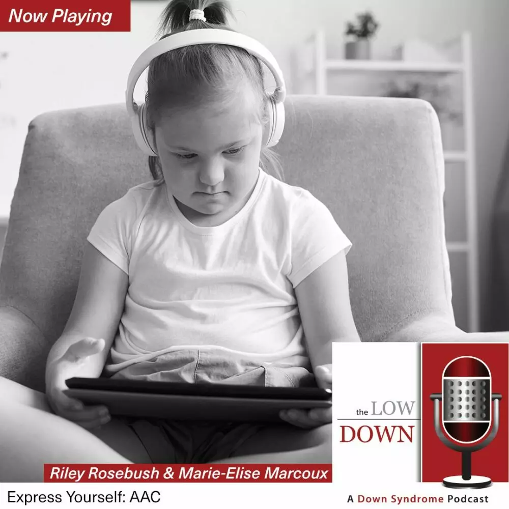 Girl with Down syndrome wearing headphones, looking at tablet on chair