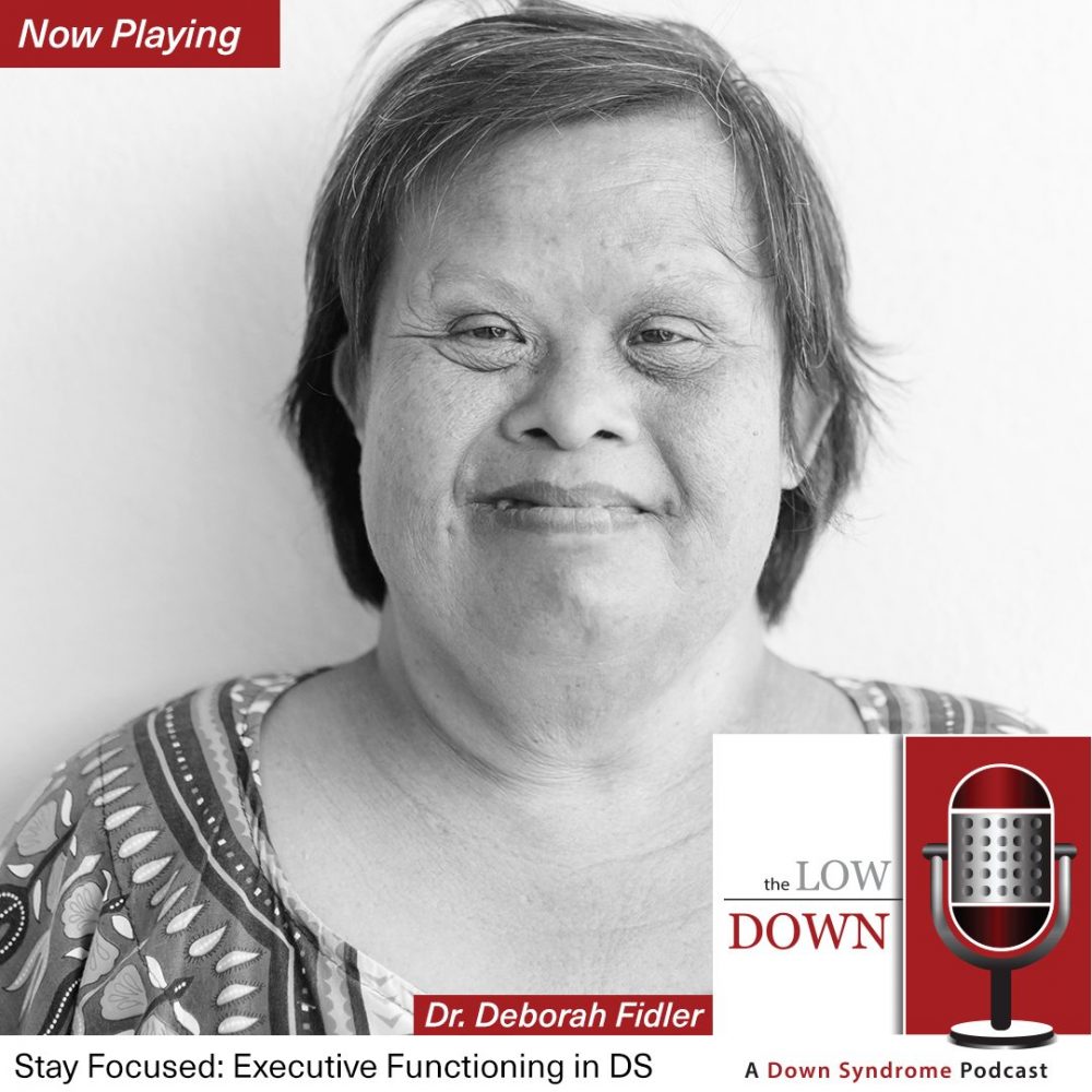 Smiling older woman of a visible minority with Down syndrome