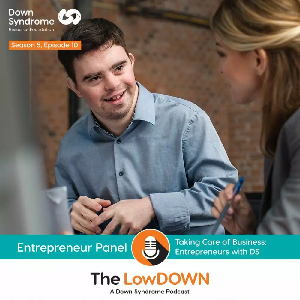Young man with Down syndrome speaks with his business colleague