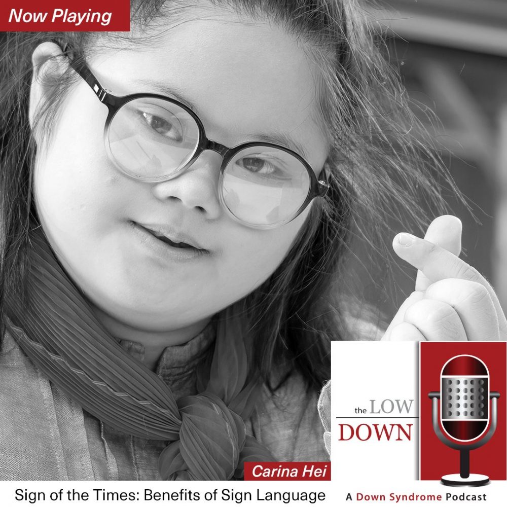 Girl with Down syndrome doing sign language