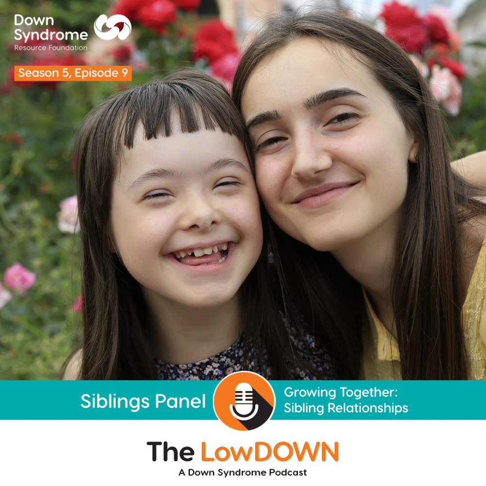 Girl with Down syndrome smiles alongside her older sister