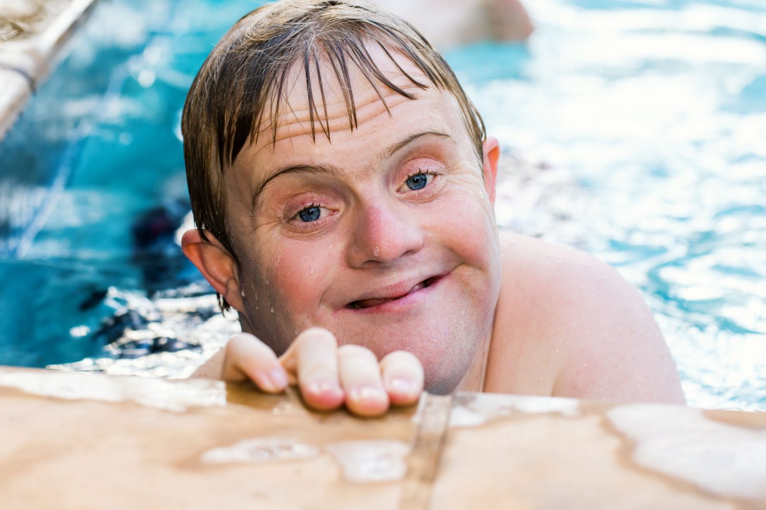 Man with Down syndrome in swimming pool