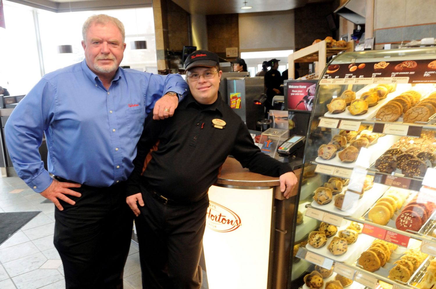 Employee with Down syndrome and his boss at Tim Hortons