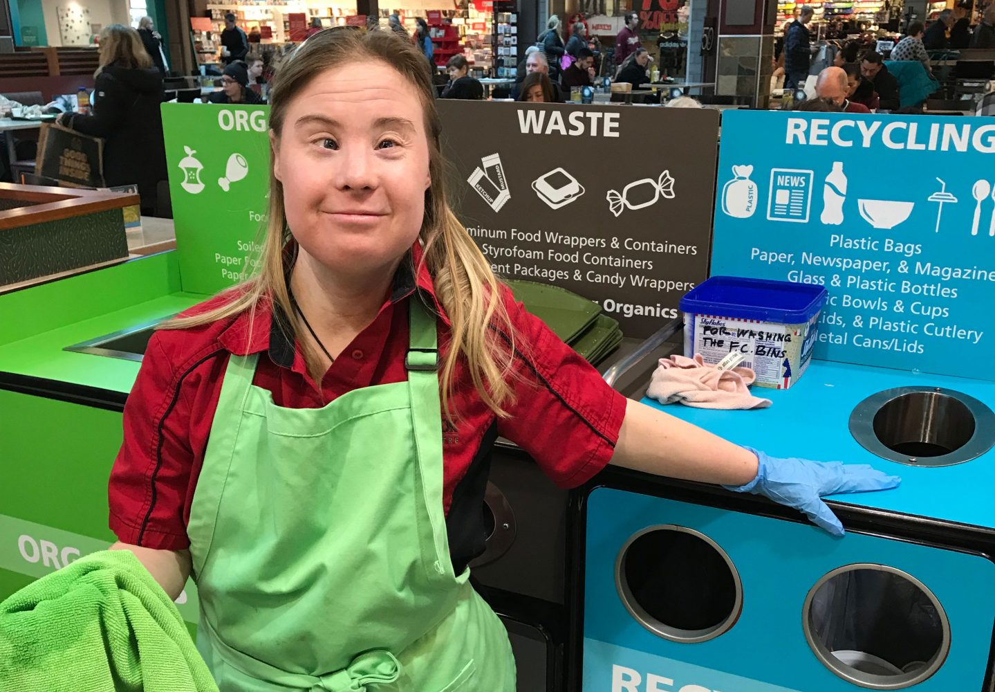 Women with Down syndrome cleans up at mall food court