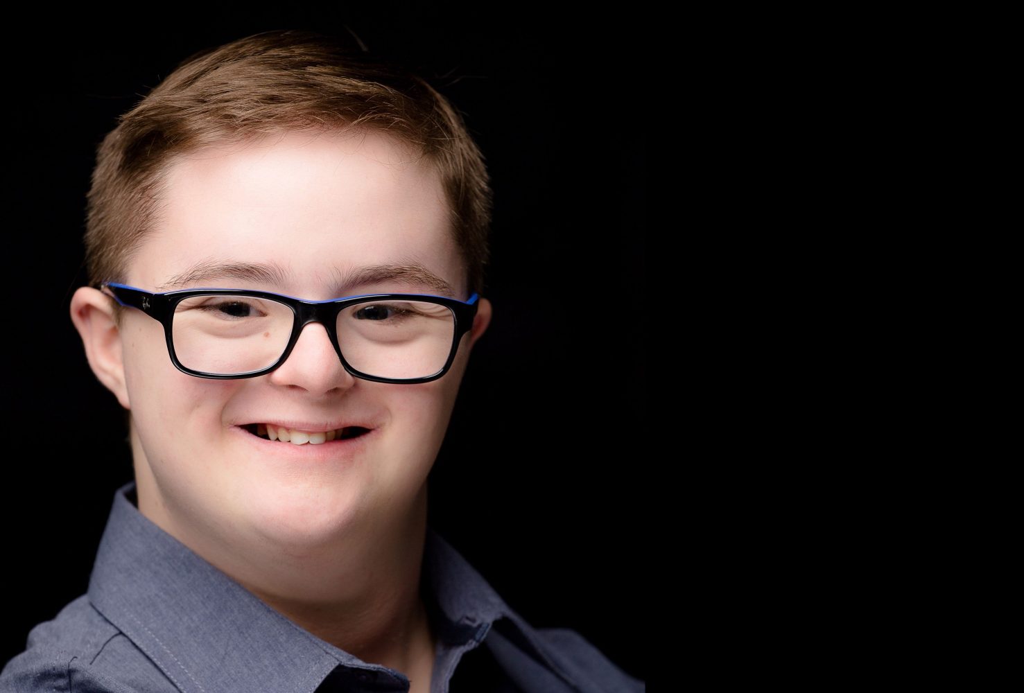 Headshot of an actor with Down syndrome