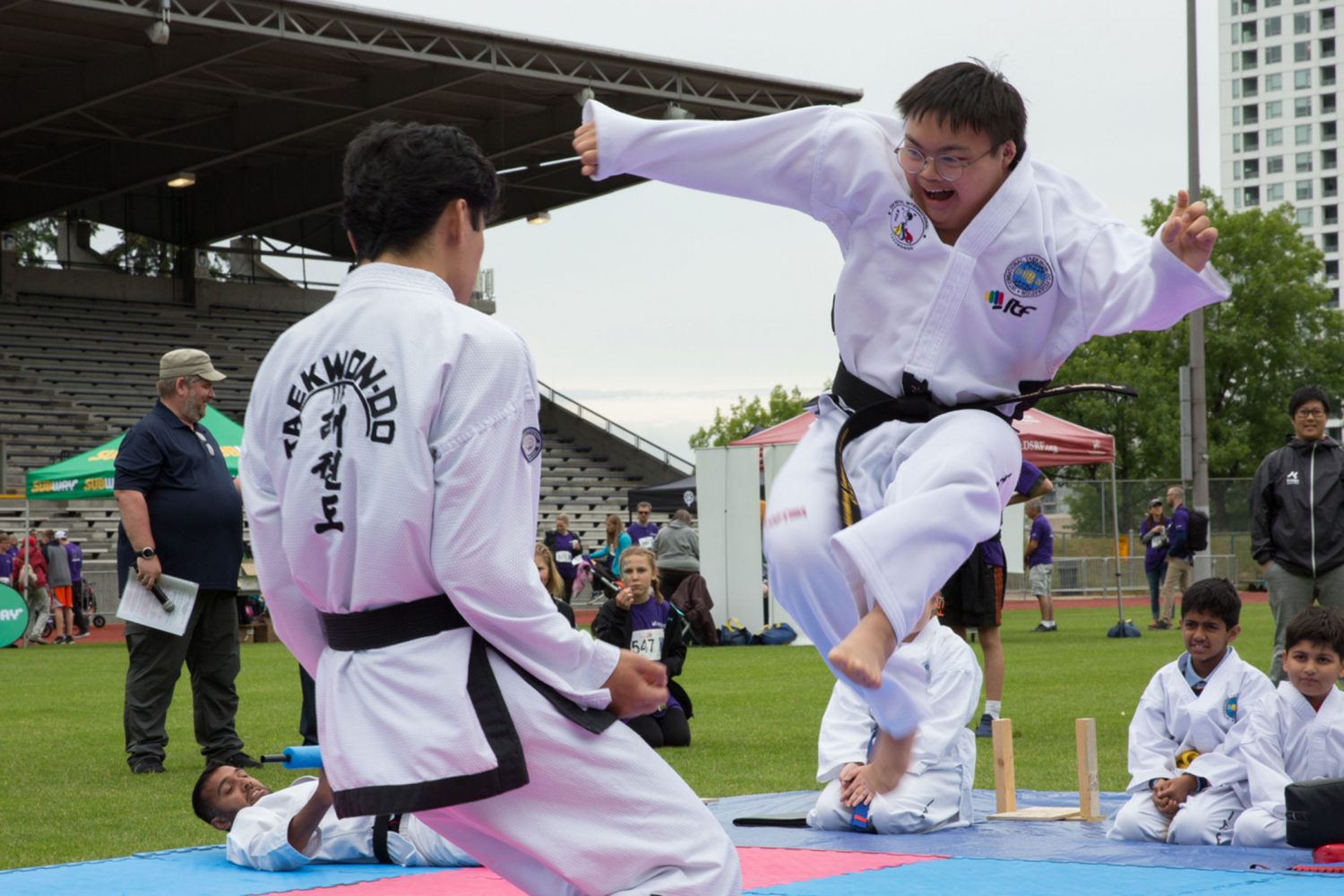 Young man with Down syndrome delivers flying kick in taekwondo demonstration