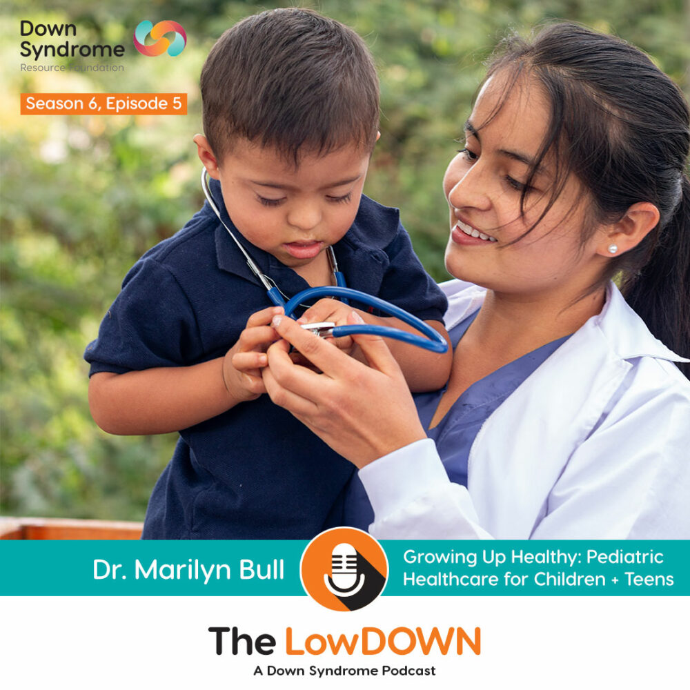 young asian boy with Down syndrome wearing stethescope, being held by asian female doctor