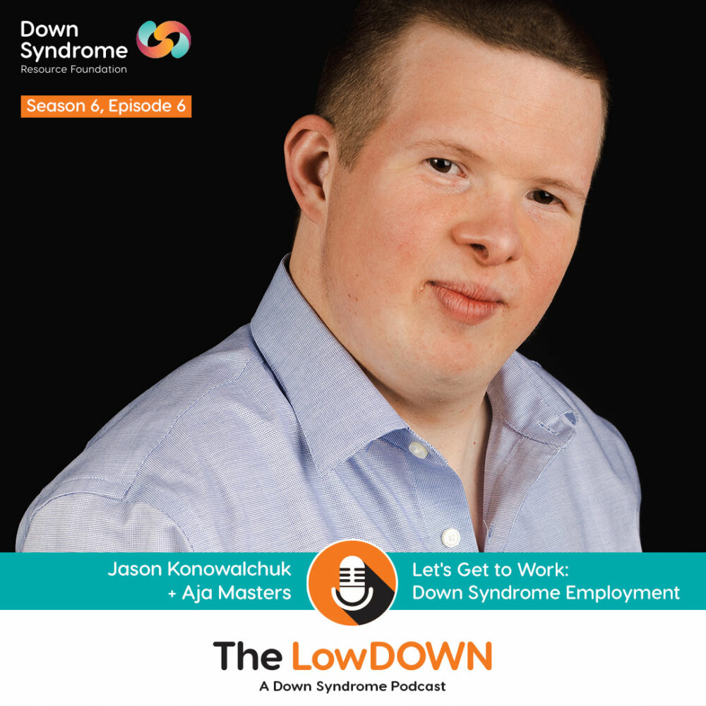 young white man with Down syndrome wearing blue dress shirt on black background