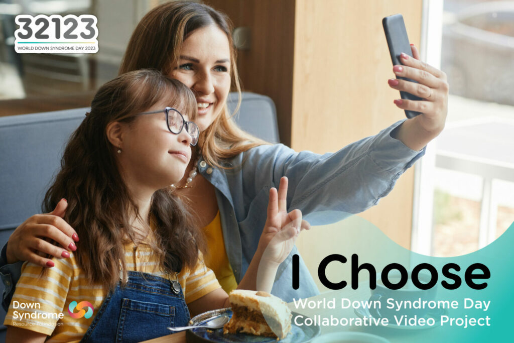 brown haired girl with Down syndrome and her mom pose together for a selfie in a restaurant booth