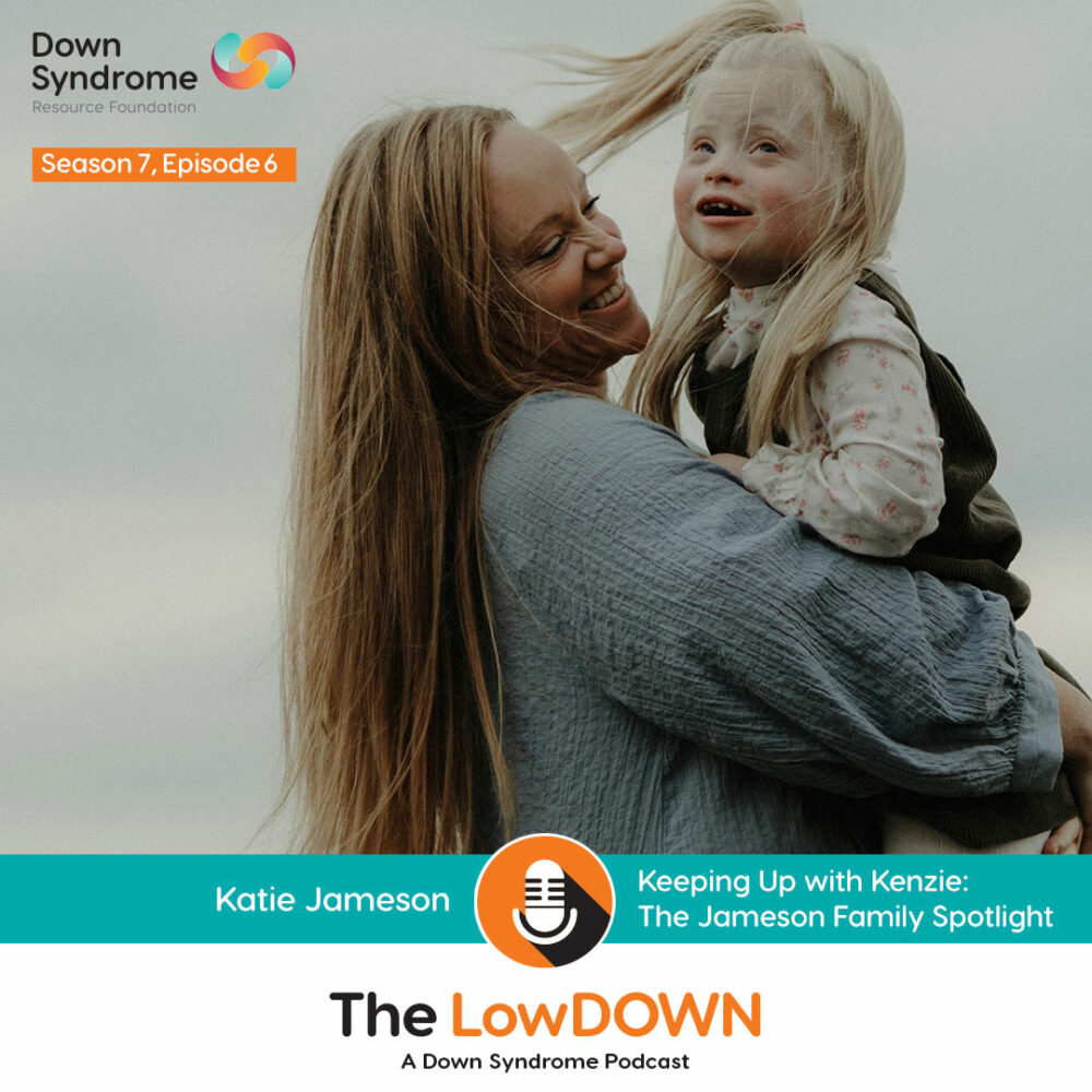 white mom with long blonde hair holds young girl with blonde hair and Down syndrome against cloudy sky