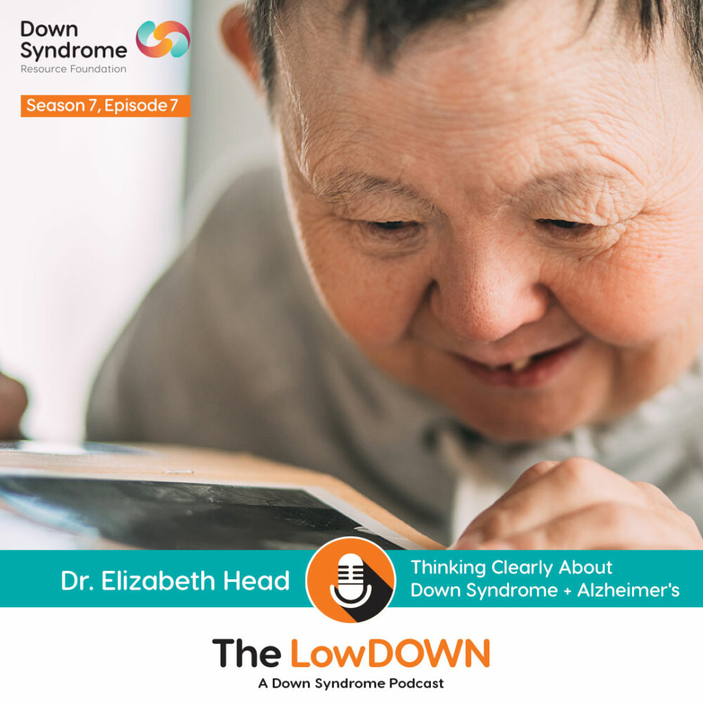 smiling elderly white woman with Down syndrome smiles while leaning forward to read