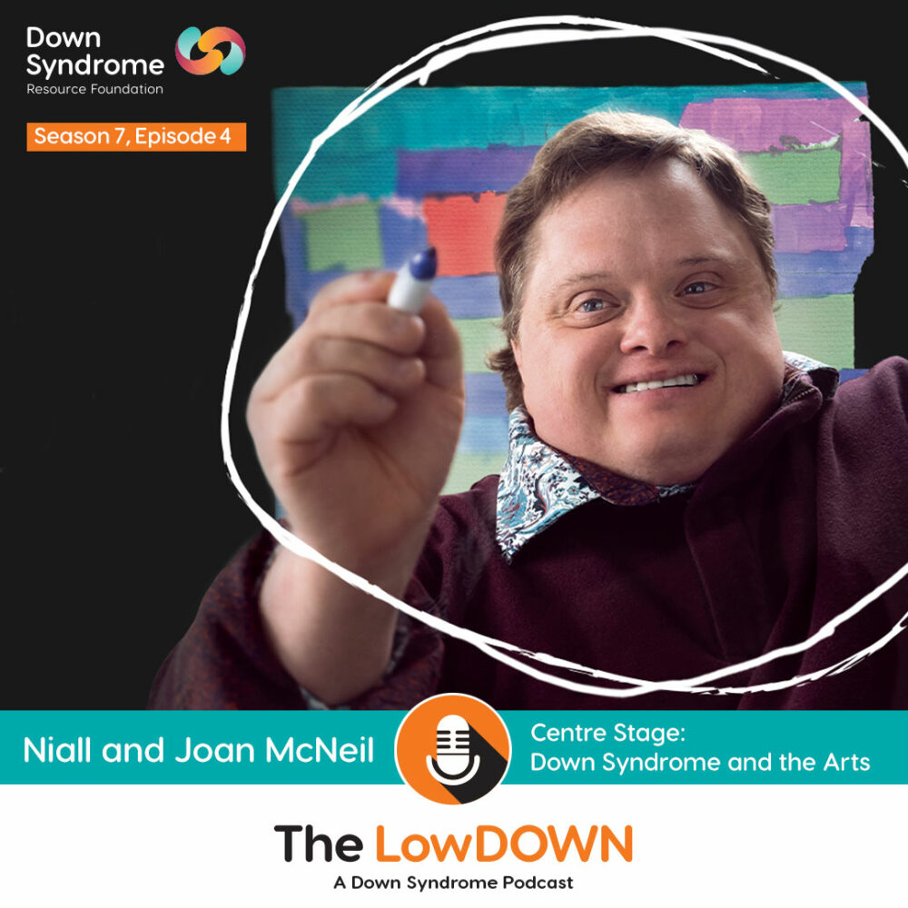 man with Down syndrome in front of colourful background draws a white circle around himself