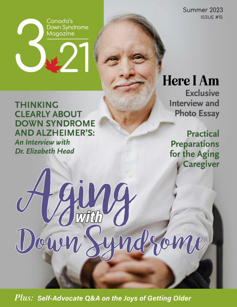 3.21 Magazine cover featuring older white gentleman with Down syndrome wearing white dress shirt with hands clasped on lap