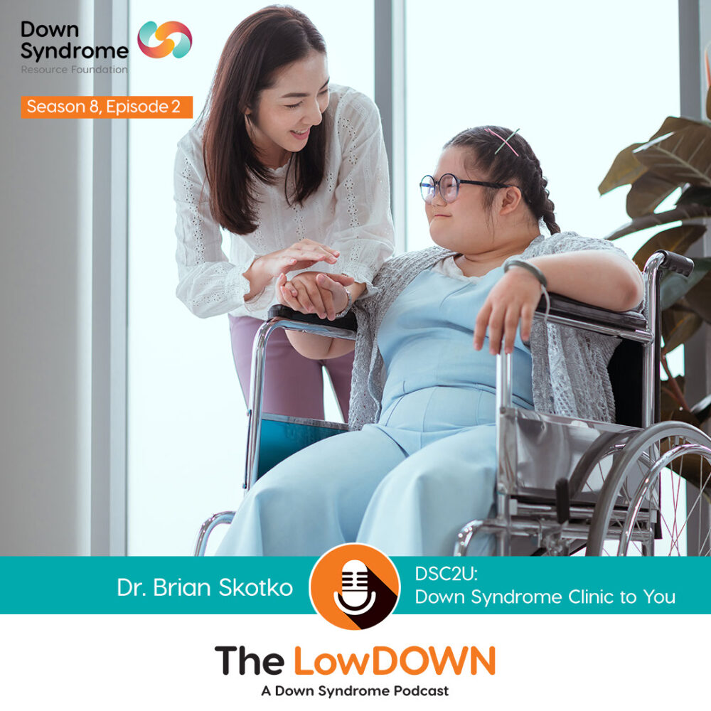 Asian woman with Down syndrome in wheelchair, with female loved one standing beside her
