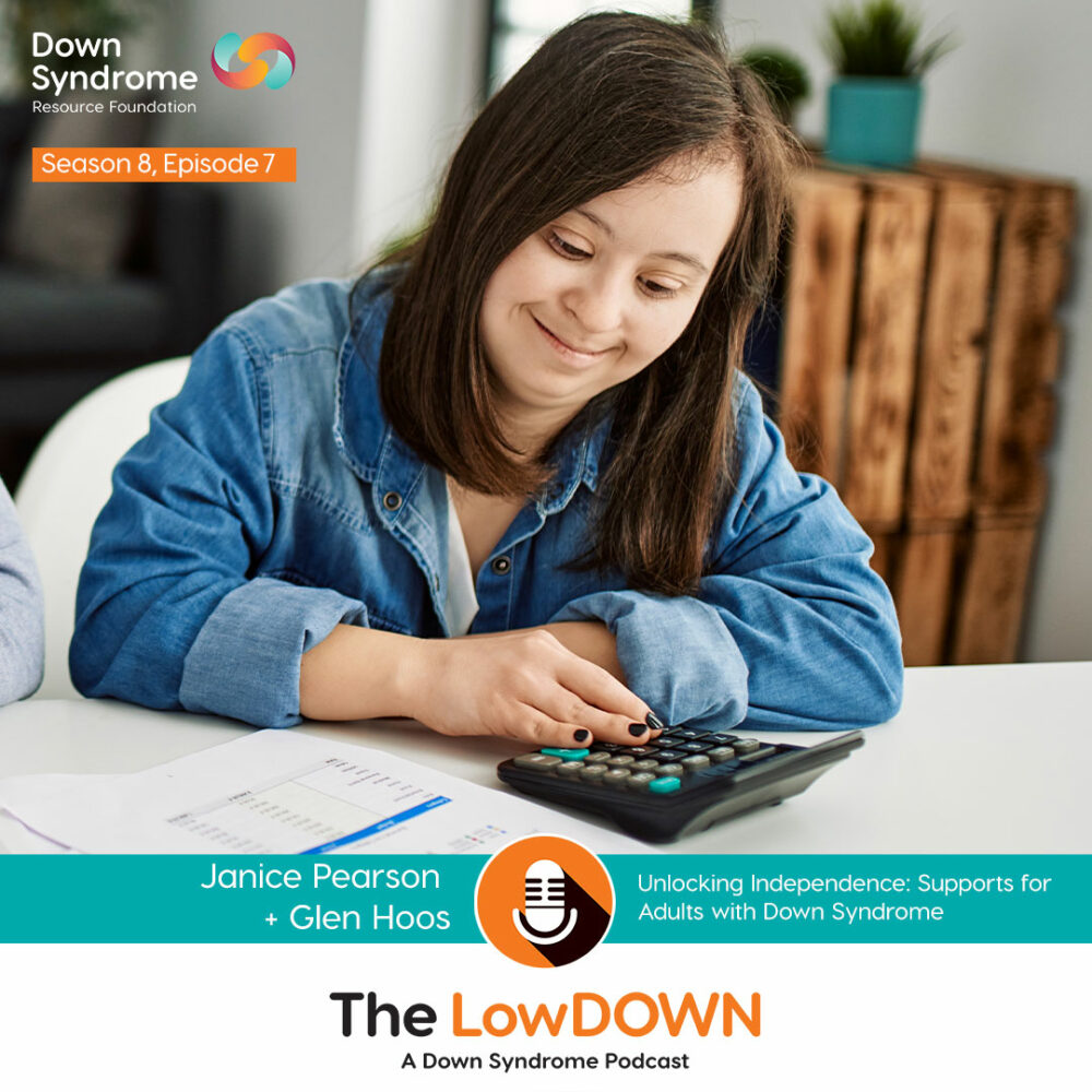 white woman with down syndrome with long brown hair and denim shirt works on a calculator
