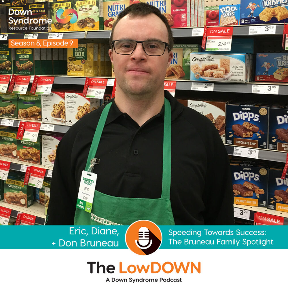 white man with Down syndrome wearing a black shirt and green apron, working in a grocery store