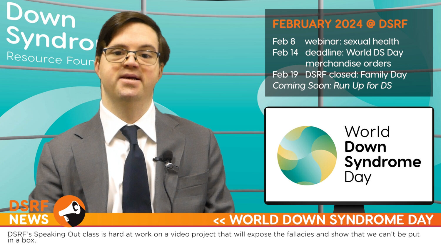 white man with Down syndrome, with brown hair, glasses, and grey suit delivers newscast from virtual news studio